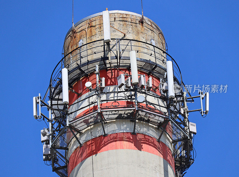 Smoke stack of the power station with antennas